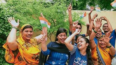 Delighted kin of hockey star Lalit Upadhyay celebrate in Varanasi on Thursday after India won the bronze medal at the Tokyo Olympics. (HT Photo) Delighted kin of hockey star Lalit Upadhyay celebrate in Varanasi on Thursday after India won the bronze medal at the Tokyo Olympics. (HT Photo)