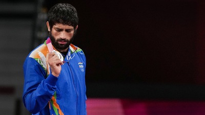 India's Ravi Dahiya holds his silver medal during the medal ceremony of the men's freestyle 57kg wrestling event at 2020 Tokyo Olympics (PTI) India's Ravi Dahiya holds his silver medal during the medal ceremony of the men's freestyle 57kg wrestling event at 2020 Tokyo Olympics (PTI)