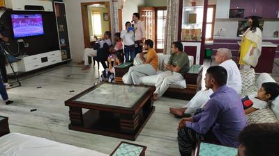 Vinesh’s uncle and Dronacharya awardee coach Mahavir Phogat watching her quarterfinal bout along with family members at the Tokyo Olympics on Thursday morning. (HT Photo)