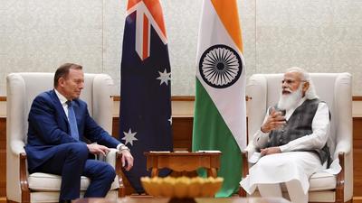 Prime Minister Narendra Modi with Australia’s special trade envoy Tony Abbott during a meeting in New Delhi on Thursday. (PTI PHOTO.) Prime Minister Narendra Modi with Australia’s special trade envoy Tony Abbott during a meeting in New Delhi on Thursday. (PTI PHOTO.)