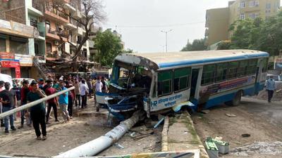 A Haryana roadways (Faridabad depot) bus collided with a divider due to brake failure at MG road in Sukhrali Village, near the community center in Gurugram, on June 15. (HT photo) A Haryana roadways (Faridabad depot) bus collided with a divider due to brake failure at MG road in Sukhrali Village, near the community center in Gurugram, on June 15. (HT photo)
