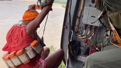 An Indian Air Force (IAF) personnel during a rescue operation due to flooding of Sind river, in Seondh on Wednesday. (ANI Photo) (ANI) An Indian Air Force (IAF) personnel during a rescue operation due to flooding of Sind river, in Seondh on Wednesday. (ANI Photo) (ANI)