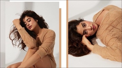 The oversized beige coloured knit top came with a modest V-neckline, cutwork work and billowy sleeves which Janhvi Kapoor wore pulled up to her elbows and looked immediately more luxe. (Instagram/vandafashionagency)