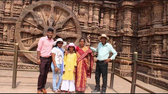 Amit Rohidas with his family at the Konark Sun Temple in Odisha. (HT PHOTO.)