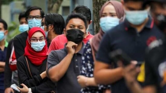 People wait in line to be tested for Covid-19 in Shah Alam, Malaysia.(Reuters file photo)