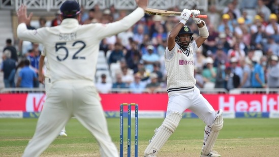 India's Cheteshwar Pujara, right, attempts to play a shot during the second day of first test cricket match between England and India, at Trent Bridge in Nottingham(AP)