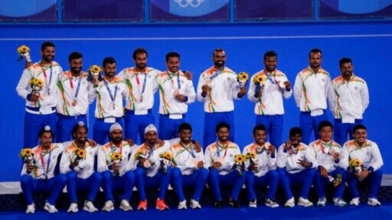 The India field hockey team poses for a photo with their bronze medal after taking third place in the men's field hockey event at the 2020 Summer Olympics, Thursday, Aug. 5, 2021, in Tokyo, Japan. (AP Photo/John Locher)(AP)