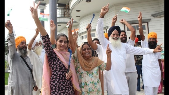 Indian hockey player Gurjant Singh’s family members celebrate at Klehara village in Amritsar, district on Thursday. (Sameer Sehgal)