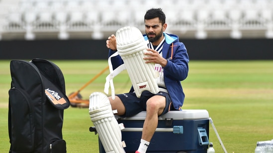 India captain Virat Kohli pads up during net practice prior to the first Test Match between England and India at Trent Bridge cricket ground in Nottingham, England.(AP)