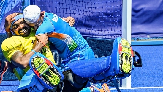 Tokyo: India's Sreejesh and Mandeep hug each other as they celebrate their victory over Germany. (PTI)