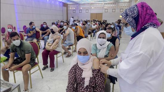 A Tunisian woman receives a dose of the Chinese Sinopharm vaccine at the Palais des Congres in the capital Tunis. (AFP) A Tunisian woman receives a dose of the Chinese Sinopharm vaccine at the Palais des Congres in the capital Tunis. (AFP)