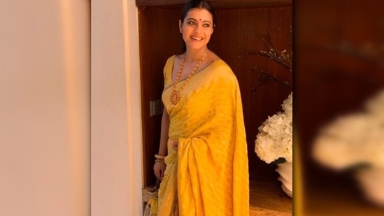 Kajol opted for the all-yellow look for her Durga Puja celebrations with friends and family. She accessorised her look with a traditional neckpiece and bangles.(Instagram/@kajol)