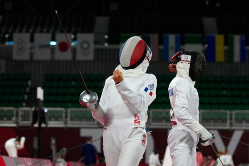 Marie Oteiza of France celebrates winning a point against Gulnaz Gubaydullina of the Russian Olympic Committee in the fencing portion of the women's modern pentathlon at the 2020 Summer Olympics, Thursday, Aug. 5, 2021, in Tokyo, Japan. (AP Photo/Hassan Ammar) Marie Oteiza of France celebrates winning a point against Gulnaz Gubaydullina of the Russian Olympic Committee in the fencing portion of the women's modern pentathlon at the 2020 Summer Olympics, Thursday, Aug. 5, 2021, in Tokyo, Japan. (AP Photo/Hassan Ammar)