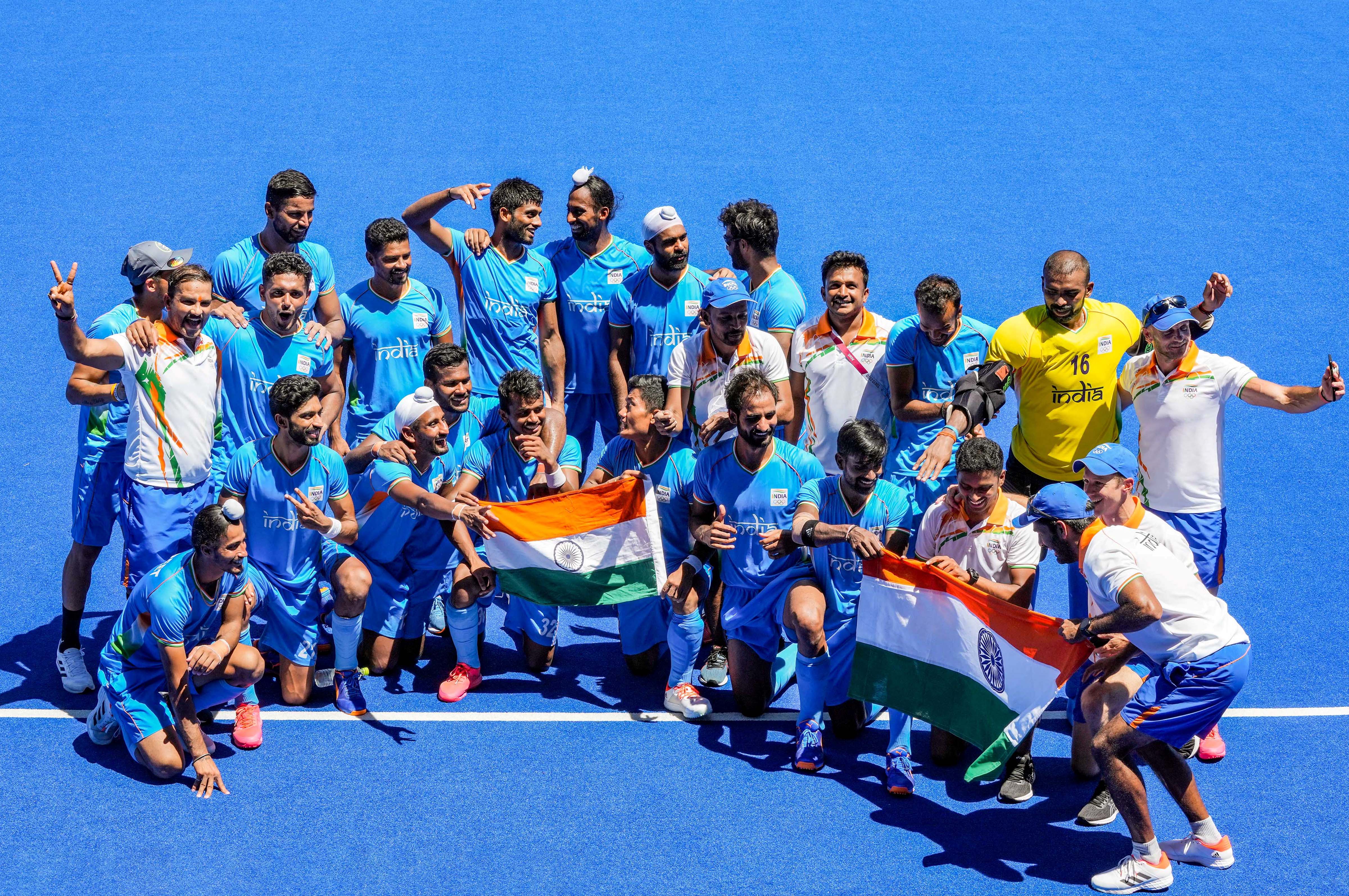 Indian players pose for group photographs as they celebrate their victory over Germany in the men's field hockey bronze medal match, at the 2020 Summer Olympics, in Tokyo, Thursday, Aug. 5, 2021. India won the match, 5-4. (PTI) Indian players pose for group photographs as they celebrate their victory over Germany in the men's field hockey bronze medal match, at the 2020 Summer Olympics, in Tokyo, Thursday, Aug. 5, 2021. India won the match, 5-4. (PTI)