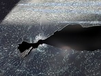 A bullet hole is seen on the window glass of a car in which director of Afghanistan’s information media centre, Dawa Khan Menapal, was seated when he was shot dead in Kabul on Friday.