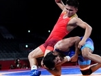 Tokyo 2020 Olympics - Wrestling - Freestyle - Men's 65kg - Last 16 - Makuhari Messe Hall A, Chiba, Japan - August 6, 2021. Ernazar Akmataliev of Kyrgyzstan in action against Bajrang Bajrang of India. REUTERS/Piroschka Van De Wouw