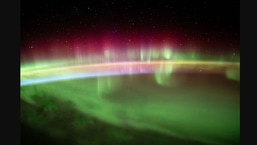 The image captured from space shows aurora australis.