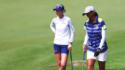 Tokyo 2020 Olympics - Golf - Women's Individual - Final - Round 3 - Kasumigaseki Country Club - Kawagoe, Saitama, Japan - August 6, 2021. Aditi Ashok of India walks past Nelly Korda of the United States. REUTERS/Murad Sezer (REUTERS)