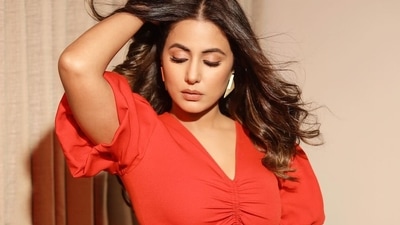 Hina was wearing a red jumpsuit that had puffed, half sleeves, a cutout on the midriff and ruching to give the top a more flattering look. (Instagram) Hina was wearing a red jumpsuit that had puffed, half sleeves, a cutout on the midriff and ruching to give the top a more flattering look. (Instagram)