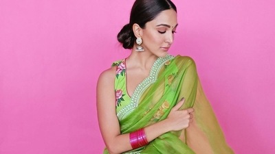 Kiara wore contrasting pink glass bangles, a floral printed top in a similar hue of green, and had her hair tied in a low bun. She glammed up with kohl lined eyes, a bindi and some subtle rosy make-up. (Instagram) Kiara wore contrasting pink glass bangles, a floral printed top in a similar hue of green, and had her hair tied in a low bun. She glammed up with kohl lined eyes, a bindi and some subtle rosy make-up. (Instagram)