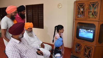 The family of Indian hockey player Gurjit Kaur, of Miyadi Kalan, watching the bronze medal match against Great Britain in Tokyo on Friday; Gurjit scored two goals in the 4-3 defeat. (Sameer Sehgal/HT)