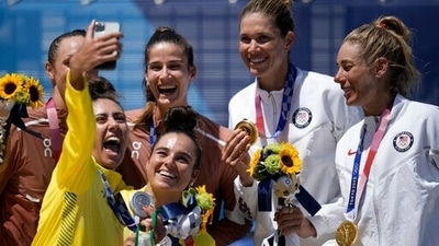 Silver medalist Mariafe Artacho del Solar, bottom left, of Australia, takes a selfie, of teammate Taliqua Clancy, bottom center, as well bronze medalist Anouk Verge-Depre, top second from left, of Switzerland, and teammate Joana Heidrich, left, and gold medalist April Ross, right, of the United States and teammate April Ross,, second from right, as during a women's beach volleyball award ceremony at the 2020 Summer Olympics, Friday, Aug. 6, 2021, in Tokyo, Japan. (AP Photo/Felipe Dana) (AP) Silver medalist Mariafe Artacho del Solar, bottom left, of Australia, takes a selfie, of teammate Taliqua Clancy, bottom center, as well bronze medalist Anouk Verge-Depre, top second from left, of Switzerland, and teammate Joana Heidrich, left, and gold medalist April Ross, right, of the United States and teammate April Ross,, second from right, as during a women's beach volleyball award ceremony at the 2020 Summer Olympics, Friday, Aug. 6, 2021, in Tokyo, Japan. (AP Photo/Felipe Dana) (AP)