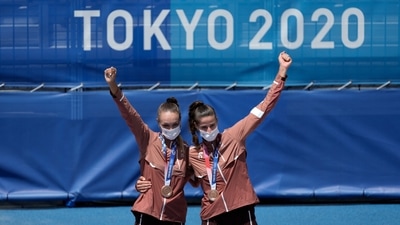 Bronze medalist Anouk Verge-Depre, left, of Switzerland, and teammate Joana Heidrich celebrate their medals during a women's beach volleyball ceremony at the 2020 Summer Olympics, Friday, Aug. 6, 2021, in Tokyo, Japan. (AP Photo/Petros Giannakouris) (AP) Bronze medalist Anouk Verge-Depre, left, of Switzerland, and teammate Joana Heidrich celebrate their medals during a women's beach volleyball ceremony at the 2020 Summer Olympics, Friday, Aug. 6, 2021, in Tokyo, Japan. (AP Photo/Petros Giannakouris) (AP)