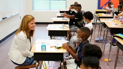Henry County Board of Education Chair Holly Cobb talks to students at Tussahaw Elementary school on Wednesday, in McDonough. (AP)