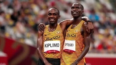 Joshua Cheptegei, of Uganda celebrates with Jacob Kiplimo, of Uganda after winning the gold medal in the final of the men's 5,000-meters at the 2020 Summer Olympics, Friday, Aug. 6, 2021, in Tokyo, Japan. (AP Photo/Charlie Riedel) (AP) Joshua Cheptegei, of Uganda celebrates with Jacob Kiplimo, of Uganda after winning the gold medal in the final of the men's 5,000-meters at the 2020 Summer Olympics, Friday, Aug. 6, 2021, in Tokyo, Japan. (AP Photo/Charlie Riedel) (AP)