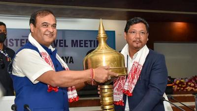 Meghalaya chief minister Conrad Sangma being felicitated by Assam chief minister Himanta Biswa Sarmah at a meeting on Assam -Meghalaya border in Guwahati on Friday. (PTI) Meghalaya chief minister Conrad Sangma being felicitated by Assam chief minister Himanta Biswa Sarmah at a meeting on Assam -Meghalaya border in Guwahati on Friday. (PTI)