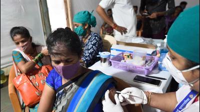 A beneficiary gets inoculated against Covid-19 at Khambacha Pada inside the Aarey Milk Colony, in Mumbai on Thursday, August 5. (Satish Bate/HT photo)