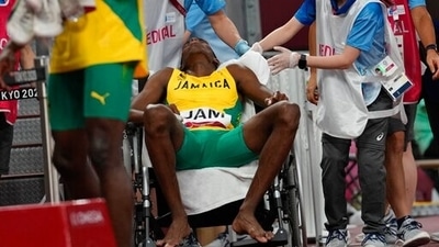 A member of the Jamaican team is taken from the track in a wheelchair after a heat of the men's 4x400-meter relay at the 2020 Summer Olympics, Friday, Aug. 6, 2021, in Tokyo. (AP Photo/Petr David Josek) (AP) A member of the Jamaican team is taken from the track in a wheelchair after a heat of the men's 4x400-meter relay at the 2020 Summer Olympics, Friday, Aug. 6, 2021, in Tokyo. (AP Photo/Petr David Josek) (AP)