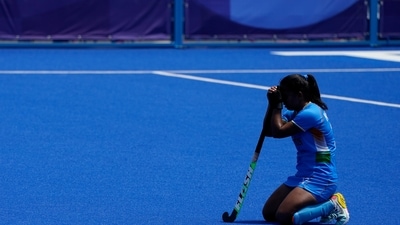 India's Neha Neha kneels on the pitch after losing their women's field hockey bronze medal match against Britain at the 2020 Summer Olympics, Friday, Aug. 6, 2021, in Tokyo, Japan. Britain won 4-3. (AP Photo/John Minchillo) (AP) India's Neha Neha kneels on the pitch after losing their women's field hockey bronze medal match against Britain at the 2020 Summer Olympics, Friday, Aug. 6, 2021, in Tokyo, Japan. Britain won 4-3. (AP Photo/John Minchillo) (AP)
