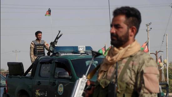 Afghan security forces keep watch at a checkpoint in the Guzara district of Herat province, Afghanistan. (REUTERS)