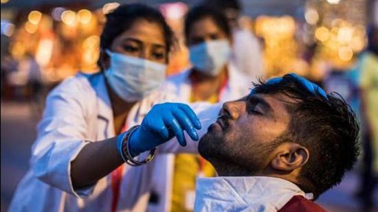 During the money laundering investigation, it was revealed that the labs were given the contract by the Uttarakhand government for conducting Rapid Antigen Test/RT-PCR tests to detect the Covid-19 viral infection during the Kumbh Mela, 2021. (AFP PHOTO.) During the money laundering investigation, it was revealed that the labs were given the contract by the Uttarakhand government for conducting Rapid Antigen Test/RT-PCR tests to detect the Covid-19 viral infection during the Kumbh Mela, 2021. (AFP PHOTO.)