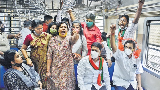 BJP workers staege demonstration inside a local train compartment , in Thane on Friday. (Praful Gangurde / HT Photo)