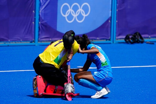 India goalkeeper Savita (11) kneels on the field after losing their women's field hockey bronze medal match against Britain at the 2020 Summer Olympics, Friday, Aug. 6, 2021, in Tokyo, Japan. Britain won 4-3. (AP Photo/John Minchillo) India goalkeeper Savita (11) kneels on the field after losing their women's field hockey bronze medal match against Britain at the 2020 Summer Olympics, Friday, Aug. 6, 2021, in Tokyo, Japan. Britain won 4-3. (AP Photo/John Minchillo)