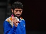 India's Ravi Dahiya holds his silver medal during the medal ceremony of the men's freestyle 57kg wrestling event at Tokyo Olympics(PTI) India's Ravi Dahiya holds his silver medal during the medal ceremony of the men's freestyle 57kg wrestling event at Tokyo Olympics(PTI)