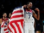 United States' Kevin Durant waves a United States flag as he celebrates with teammates after their win over France in a men's basketball Gold medal game at the 2020 Tokyo Olympics(AP) United States' Kevin Durant waves a United States flag as he celebrates with teammates after their win over France in a men's basketball Gold medal game at the 2020 Tokyo Olympics(AP)