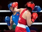 Turkey's Busenaz Surmeneli, right, punches China's Cu Hong during their women's welterweight 69-kg boxing gold medal match at the 2020 Summer Olympics, Saturday, Aug. 7, 2021, in Tokyo, Japan. (AP Photo/Themba Hadebe)(AP) Turkey's Busenaz Surmeneli, right, punches China's Cu Hong during their women's welterweight 69-kg boxing gold medal match at the 2020 Summer Olympics, Saturday, Aug. 7, 2021, in Tokyo, Japan. (AP Photo/Themba Hadebe)(AP)