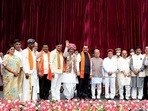 Karnataka governor Thawar Chand Gehlot and chief minister Basavaraj Bommai with newly inducted ministers during swearing-in ceremony to form the cabinet at Raj Bhavan in Bengaluru.(PTI) Karnataka governor Thawar Chand Gehlot and chief minister Basavaraj Bommai with newly inducted ministers during swearing-in ceremony to form the cabinet at Raj Bhavan in Bengaluru.(PTI)