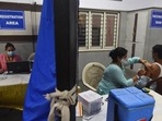 A health worker administers a dose of Covid-19 vaccine to a beneficiary, at a government school at DDU Marg in New Delhi. A health worker administers a dose of Covid-19 vaccine to a beneficiary, at a government school at DDU Marg in New Delhi.