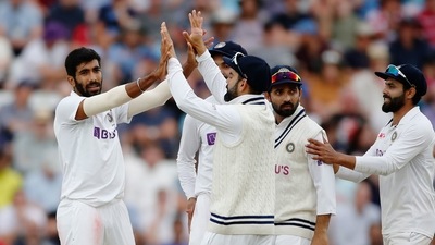 India's Jasprit Bumrah celebrates taking the wicket of England's Jos Buttler with teammates (Action Images via Reuters)