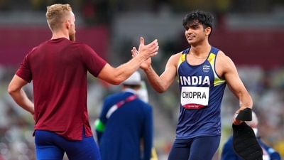 Tokyo 2020 Olympics - Athletics - Men's Javelin Throw - Final - Olympic Stadium, Tokyo, Japan - August 7, 2021. Neeraj Chopra of India who won gold greets Jakub Vladejch of Czech Republic who won silver REUTERS/Aleksandra Szmigiel (REUTERS)