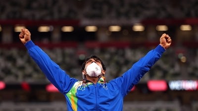 Tokyo 2020 Olympics - Athletics - Men's Javelin Throw - Medal Ceremony - Olympic Stadium, Tokyo, Japan - August 7, 2021. Gold medallist Neeraj Chopra of India celebrates on the podium (REUTERS)