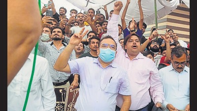 People watching javelin thrower Neeraj Chopra’s gold medal-winning performance at his native Khandra village in Panipat district on Saturday.