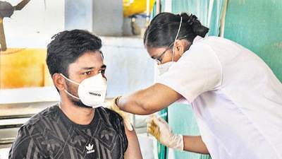 A beneficiary receives a dose of Covid-19 vaccine during a free vaccination camp at St. Joseph's Higher Secondary School in Thiruvananthapuram on August 1. (PTI)