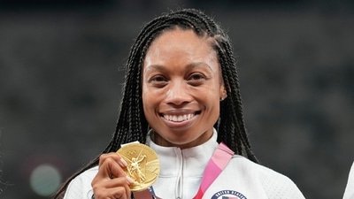 Allyson Felix, of United States, poses with her gold medal for the women's 4 x 400-meter relay at the 2020 Summer Olympics, Saturday, Aug. 7, 2021, in Tokyo. (AP Photo/Martin Meissner) (AP) Allyson Felix, of United States, poses with her gold medal for the women's 4 x 400-meter relay at the 2020 Summer Olympics, Saturday, Aug. 7, 2021, in Tokyo. (AP Photo/Martin Meissner) (AP)