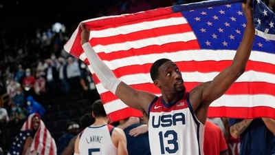 United States' Bam Adebayo (13) waves the United States flag as he celebrates with teammates after their win over France in a men's basketball Gold medal game at the 2020 Summer Olympics, Saturday, Aug. 7, 2021, in Saitama, Japan. (AP Photo/Eric Gay) (AP) United States' Bam Adebayo (13) waves the United States flag as he celebrates with teammates after their win over France in a men's basketball Gold medal game at the 2020 Summer Olympics, Saturday, Aug. 7, 2021, in Saitama, Japan. (AP Photo/Eric Gay) (AP)