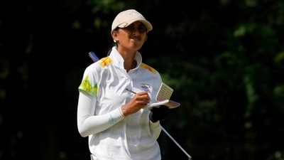 Aditi Ashok, of India, writes on her scorecard on the third hole during the final round of the women's golf event at the 2020 Tokyo Olympics (AP) Aditi Ashok, of India, writes on her scorecard on the third hole during the final round of the women's golf event at the 2020 Tokyo Olympics (AP)
